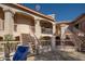 Exterior of condo building with stairs and a patio area at 9151 W Greenway Rd # 276, Peoria, AZ 85381