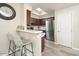 Modern kitchen with stainless steel appliances and breakfast bar at 9151 W Greenway Rd # 276, Peoria, AZ 85381