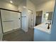 Bathroom with walk-in shower, double vanity, and gray tile floor at 9346 E Sequence Ave, Mesa, AZ 85212