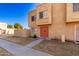 Tan two-story townhome with red door and small front yard at 948 S Alma School Rd # 29, Mesa, AZ 85210