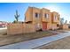 Tan two-story townhome with red door and small front yard at 948 S Alma School Rd # 29, Mesa, AZ 85210