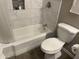 Updated bathroom with a bathtub, toilet and vanity at 9902 W Coggins Dr, Sun City, AZ 85351