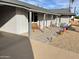 Inviting front porch with a wooden bench and paved walkway at 9902 W Coggins Dr, Sun City, AZ 85351