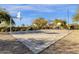 Well-maintained basketball court surrounded by trees, providing a great recreational space at 9980 E Charter Oak Rd, Scottsdale, AZ 85260