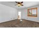 Bedroom featuring plush carpet, neutral walls and a fan at 9980 E Charter Oak Rd, Scottsdale, AZ 85260