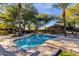 Sparkling pool with steps leading into the water and a beautiful backyard landscape view at 9980 E Charter Oak Rd, Scottsdale, AZ 85260