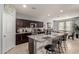 Granite kitchen island with seating for three at 1061 W Descanso Canyon Dr, Casa Grande, AZ 85122