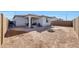 Large backyard with covered patio, fire pit, and plenty of space at 12530 W Levi Dr, Avondale, AZ 85323