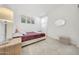Bedroom with a queen bed, window with curtains, and neutral decor at 12530 W Levi Dr, Avondale, AZ 85323
