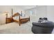 Main bedroom with large wood bed frame, comfortable seating, and window at 12530 W Levi Dr, Avondale, AZ 85323