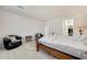Spacious bedroom with a large bed, comfortable chair, and walk-in closet at 12530 W Levi Dr, Avondale, AZ 85323