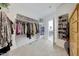 Walk-in closet offers hanging rods, shelves, and shoe storage at 12530 W Levi Dr, Avondale, AZ 85323