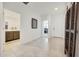 Bright entryway with tile flooring, access to bathroom, and views to other rooms at 12530 W Levi Dr, Avondale, AZ 85323