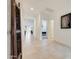 Long hallway with tile floors and access to bedrooms at 12530 W Levi Dr, Avondale, AZ 85323