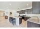 Modern kitchen with granite countertops and kitchen island at 12530 W Levi Dr, Avondale, AZ 85323