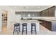 Modern kitchen with granite countertops and kitchen island at 12530 W Levi Dr, Avondale, AZ 85323