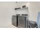 Laundry room with washer, dryer and shelving at 12530 W Levi Dr, Avondale, AZ 85323