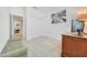 Spacious office with wood desk, window with blinds, and plush bench at 12530 W Levi Dr, Avondale, AZ 85323