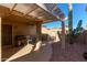 Private backyard with pergola, grill, and desert landscaping at 13652 W Aleppo Dr, Sun City West, AZ 85375