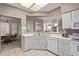 Kitchen with breakfast bar and view into dining area at 13652 W Aleppo Dr, Sun City West, AZ 85375