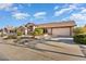 Single-story home with a two-car garage and solar panels at 13907 W Gable Hill Dr, Sun City West, AZ 85375