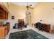 Spacious home office with two desks and a view into hallway at 13907 W Gable Hill Dr, Sun City West, AZ 85375