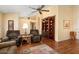 Bright living room with hardwood floors and comfortable armchairs at 13907 W Gable Hill Dr, Sun City West, AZ 85375