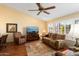 Living room with wood flooring, neutral walls, and comfy seating at 13907 W Gable Hill Dr, Sun City West, AZ 85375