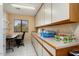 Home office with built in wooden shelving at 13907 W Gable Hill Dr, Sun City West, AZ 85375