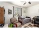 Cozy bedroom with a daybed, comfortable chair, and stylish decor at 14765 W Alexandria Way, Surprise, AZ 85379