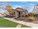 Charming single-story home with well-maintained landscaping and inviting curb appeal at 14765 W Alexandria Way, Surprise, AZ 85379