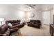 Cozy living room featuring plush leather seating and natural light at 14765 W Alexandria Way, Surprise, AZ 85379
