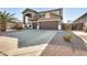 Two-story house with a three-car garage and desert landscaping at 14869 W Cortez St, Surprise, AZ 85379