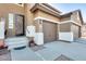 Front entry with decorative door and stairs at 14869 W Cortez St, Surprise, AZ 85379