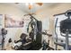 Home gym featuring a weight machine, stationary bike, and elliptical at 14869 W Cortez St, Surprise, AZ 85379