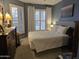 Bright bedroom with a queen bed and plenty of natural light at 14950 W Mountain View Blvd # 5112, Surprise, AZ 85374