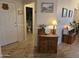 Entryway with tile flooring, antique furniture and access to the bathroom at 14950 W Mountain View Blvd # 5112, Surprise, AZ 85374