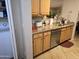 Kitchen features granite countertops, stainless steel dishwasher, and ample wood cabinets at 14950 W Mountain View Blvd # 5112, Surprise, AZ 85374