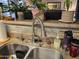 Kitchen sink with modern faucet and tile backsplash at 14950 W Mountain View Blvd # 5112, Surprise, AZ 85374
