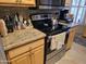 Modern kitchen with granite countertops and stovetop at 14950 W Mountain View Blvd # 5112, Surprise, AZ 85374