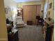 Home office with a built-in murphy bed and ample shelving at 14950 W Mountain View Blvd # 5112, Surprise, AZ 85374