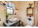 Charming bathroom with vintage fixtures, granite countertop, and ample natural light at 16241 E Trevino Dr, Fountain Hills, AZ 85268