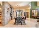 Formal dining room with a stone accent wall, elegant lighting, and decorative window coverings at 16241 E Trevino Dr, Fountain Hills, AZ 85268