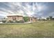 Single story stucco home with manicured lawn and desert landscaping in front yard at 1716 S 141St Pl, Gilbert, AZ 85295