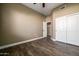 Bedroom features wood-look floors, sliding closet doors, and a ceiling fan at 1890 W Wisteria Dr, Chandler, AZ 85248