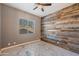 Bedroom with wood-look walls and concrete flooring at 1890 W Wisteria Dr, Chandler, AZ 85248