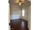 Bright bedroom featuring wainscoting and a large window, showcasing elegant details and natural light at 1890 W Wisteria Dr, Chandler, AZ 85248