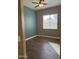Cozy bedroom featuring dark wood floors and a window with blinds for adjustable lighting at 1890 W Wisteria Dr, Chandler, AZ 85248