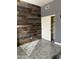 Unique bedroom featuring a rustic wood accent wall and modern gray paint at 1890 W Wisteria Dr, Chandler, AZ 85248