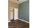 Inviting bedroom with wood-look floors and ample closet space, featuring contemporary colors at 1890 W Wisteria Dr, Chandler, AZ 85248